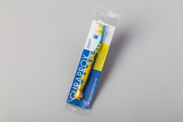 Eine Zahnbürste als Verpackungsmuster für eine Schlauchbeutelverpackung